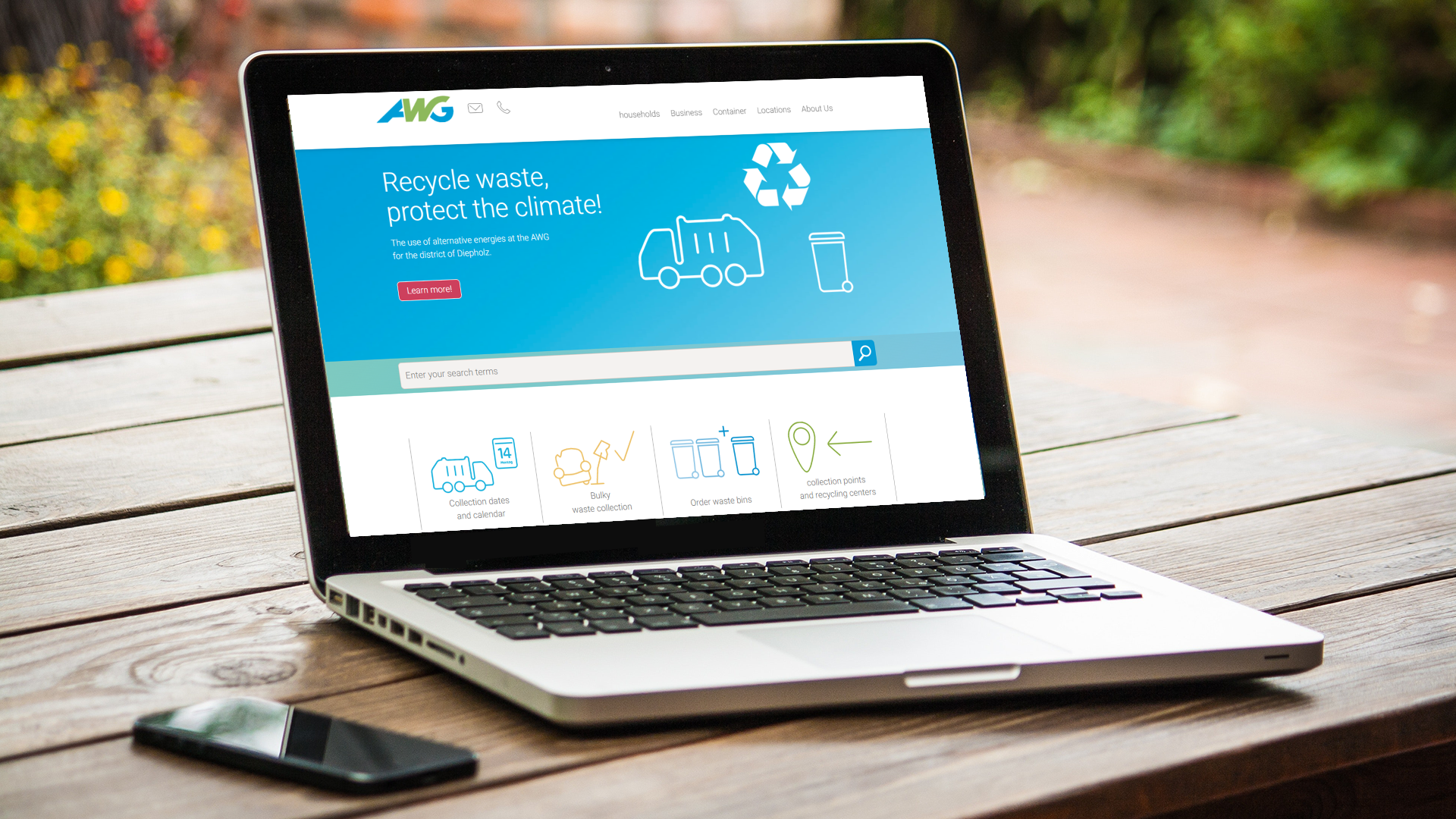 Laptop, der die Startseite der AWG Website auf englisch zeigt